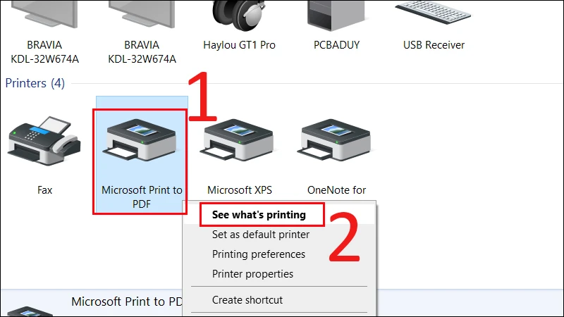 Bước 2: Nhấp chuột phải vào máy in cần xử lý, sau đó chọn See what's printing.